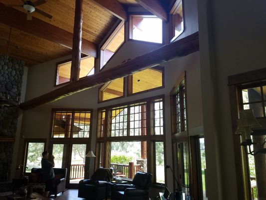 Vaulted great room with floor-to-ceiling and clerestory windows cleaned for bright interior light